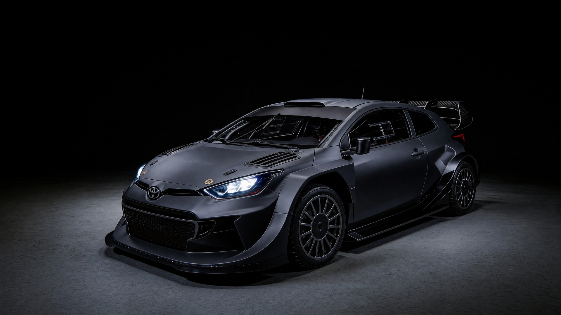 Toyota Yaris GR rally build — side profile showing widebody flares and roof scoop